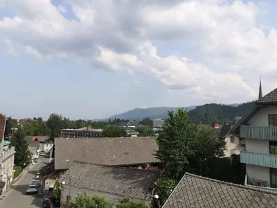 a view of a town with mountains in the background at Sobe SM0LEJ in Bled