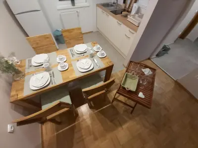 an overhead view of a table and chairs in a kitchen at Apartma Arnež in Bled