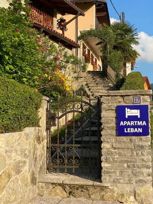 a gate to a house with a sign on it at Apartma Leban Most na Soči in Most na Soči