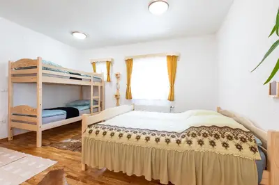 a bedroom with a bunk bed and a ladder at Apartment Life in Bled