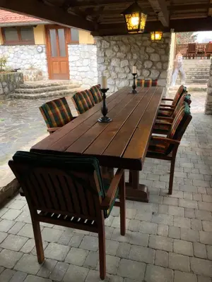 a long wooden table with chairs and sidx sidx sidx sidx at Apartments Kamp Podgrad Vransko in Vransko