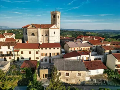 an aerial view of a town with a clock tower at Suites DANICA in Šmartno