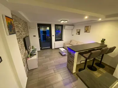 a living room with a couch and a table at Castle View in Tolmin