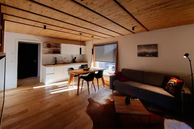 a living room with a couch and a table at Apartmaji štAla in Kranjska Gora