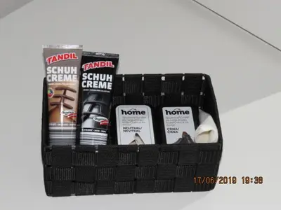 a black basket filled with products on a table at Sunlight Apartment in Bled