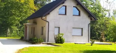 a white house with a gambrel roof at Villa FRIDA in Rogaška Slatina