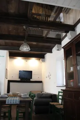 a living room with a couch and a table at Apartma Skednj in Kobarid