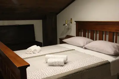 a bedroom with two towels on a bed at Apartma Skednj in Kobarid