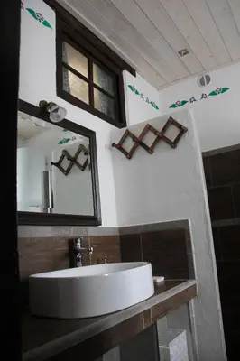 a bathroom with a sink and a mirror at Apartma Skednj in Kobarid