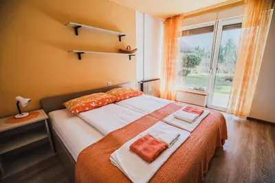 a bedroom with a bed with two towels on it at Apartma Rombon Brdo with Free Onsite Parking in Bovec