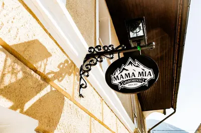 a sign on the side of a building at Mama Mia Apartments in Radovljica