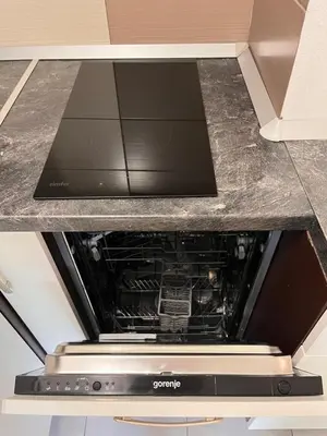 an oven in the middle of a kitchen at APARTMA BENY with SAUNA in Žaga