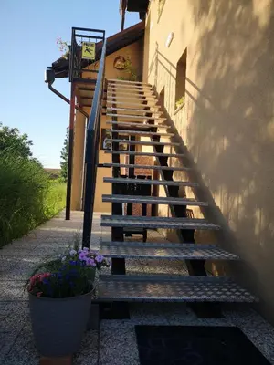 a set of stairs leading up to a building at Rooms Osmica- Videm pri Ptuju in Videm pri Ptuju