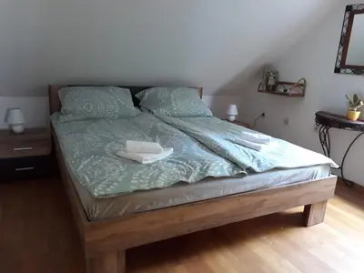a bed with two towels on top of it at Apartma Dolomiti in Ljubljana
