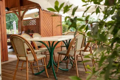 a table and chairs sitting in a restaurant at Guesthouse Turšič in Vrhnika