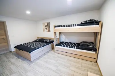 two bunk beds sitting in a room with at Guesthouse Urša in Preddvor