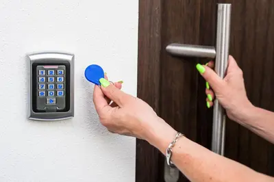 a person unlocking a door with a key and a calculator at Guesthouse Urša in Preddvor