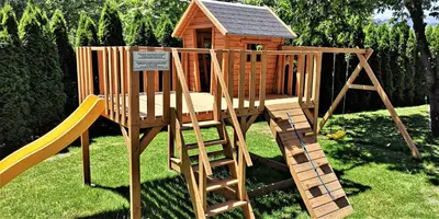 a wooden playground with a slide and a play house at Vila Ključe Apartments in Bled