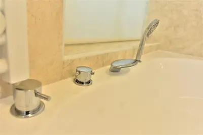 a sink with a toothbrush sitting on top of it at Vila Ključe Apartments in Bled