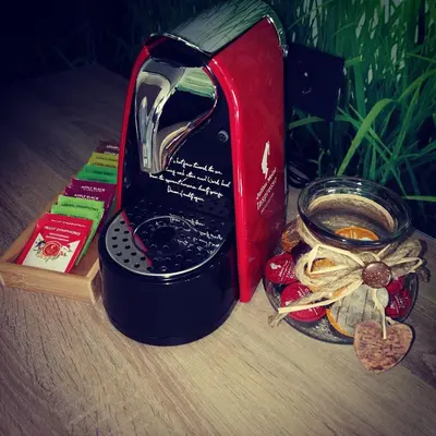 a coffee maker sitting next to a bag of cookies at Chilly apartment in Bled