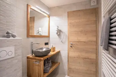 a bathroom with a sink and a mirror at Chilly apartment in Bled