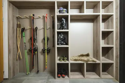 a room with skis and other equipment in a wall at Residence Novak Bohinj in Bohinj