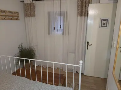 a bedroom with a bed and a walk in shower at InGreen house in Bohinjska Bela