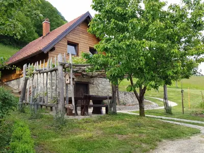 a house with a picnic table in front of it at Relaxing Cottage Donacka Gora in Rogatec