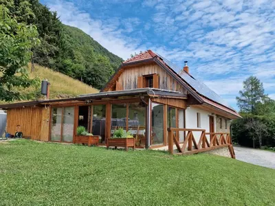 a house with large glass windows on a hill at Vacation House Donacka Gora in Rogatec