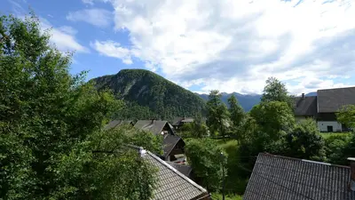 a view of a town with a mountain in the background at Apartmaji Pekovec Bohinj in Bohinj