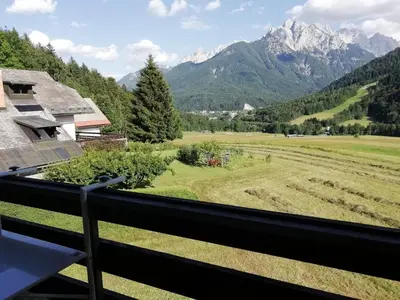 a view from the balcony of the mountains at JULIJA 3 SUNNY APPARTMENT in Kranjska Gora