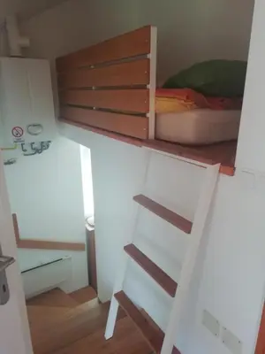 a small room with a bed and a desk at JULIJA 3 SUNNY APPARTMENT in Kranjska Gora
