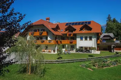 a large house with solar panels on it at Penzion Kaps in Bled