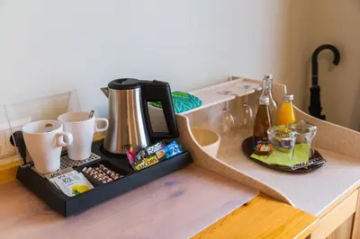 a coffee maker on top of a counter at Penzion Kaps in Bled