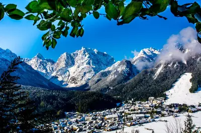 a ski resort in the mountains with snow at Klass 103 in Kranjska Gora