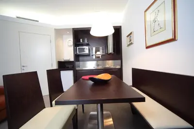 a dining room table with a bowl on top of it at Klass 103 in Kranjska Gora