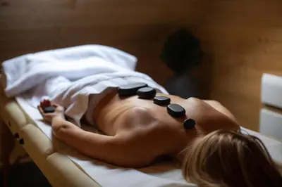 a naked baby laying in a hospital bed with pills at Kozjanski dvor in Podčetrtek