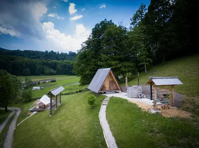 an aerial view of a cabin in a field at PUŽMAN Farm Glamping in Radovljica