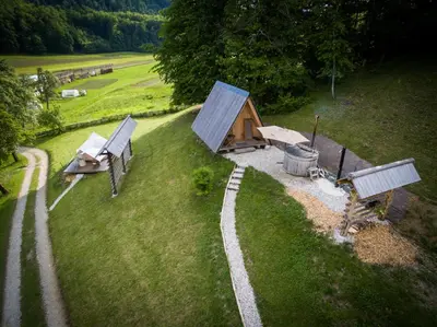 an aerial view of a cabin in a field at PUŽMAN Farm Glamping in Radovljica