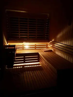a bench in the dark with a light on it at Kopiše in Zoll