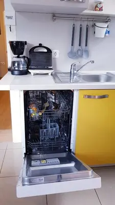 a dishwasher in the middle of a kitchen at APARTMA SVETINA in Bled