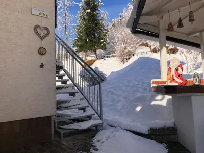 a snow covered stairway to a house with a pile of snow at SavaDolinka House ID 116O7O in Mojstrana
