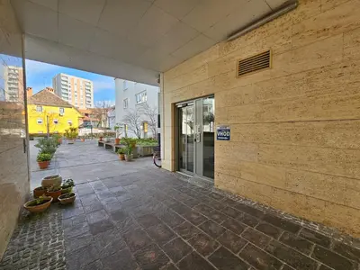 an external view of a building with a stone courtyard at Apartment Irena Tour As Ljubljana in Ljubljana