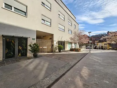 an empty street in front of a building at Apartment Irena Tour As Ljubljana in Ljubljana