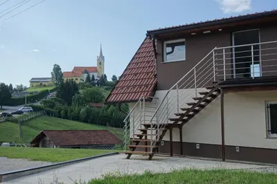 a staircase on the side of a building at Apartments Laura FARM STAY in Podčetrtek