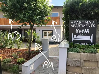 a sign for the entrance to the apartment apartments salula at Apartment Šelih in Maribor