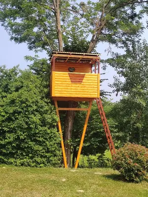 a tree house sitting on top of a tree at Brunarica Lorentia in Bizeljsko