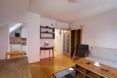 a living room with a couch and a table at Spacious 2-bedroom apartment Zabjak with AC Tour As Ljubljana in Ljubljana