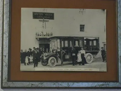 an old picture of a group of people in front of a car at Guesthouse Muha in Lipica