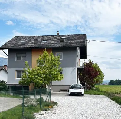 a white car parked in front of a house at Lesnavesna designer Apartment with a garden in Visoko